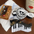 Alorar musical symbols hair claw clamp with intricate note designs, perfect for stylishly securing hair.