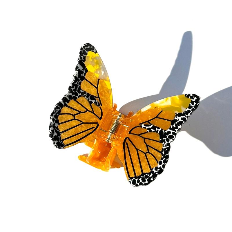 Alorar Colias Butterfly Hair Claw in a vibrant butterfly design, ideal for securing hair in a stylish updo.