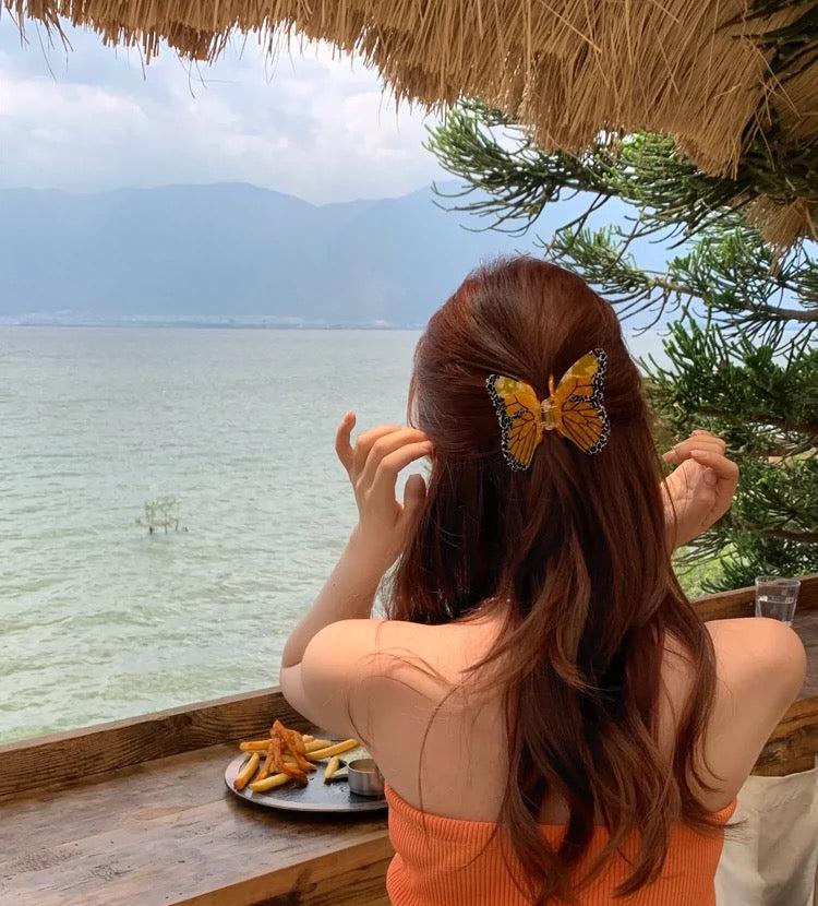 Alorar Colias Butterfly Hair Claw in a vibrant butterfly design, ideal for securing hair in a stylish updo.