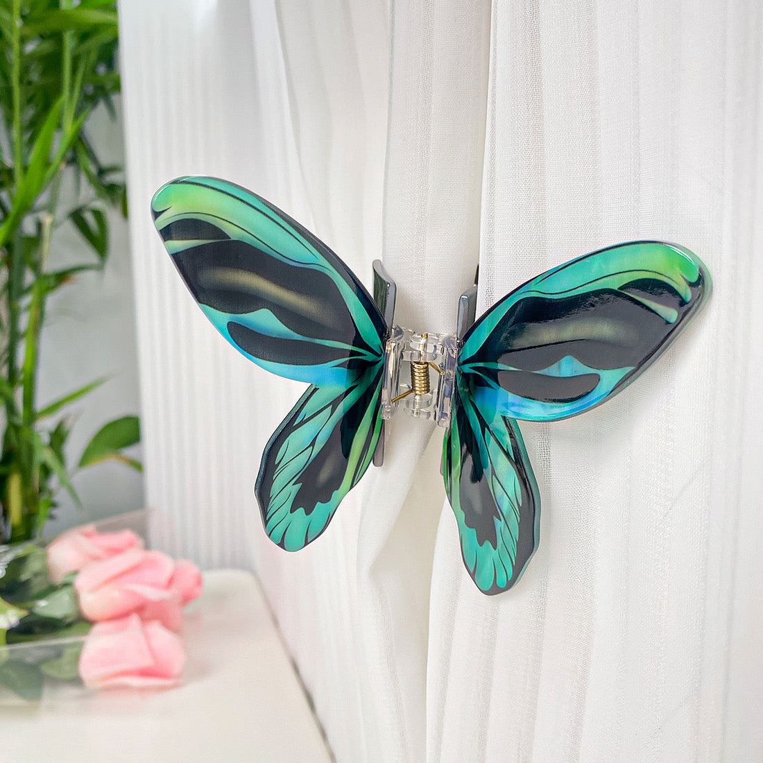 Blue green flash butterfly hair claw clamp by Alorar, featuring intricate butterfly design and sturdy grip for stylish hair styling.