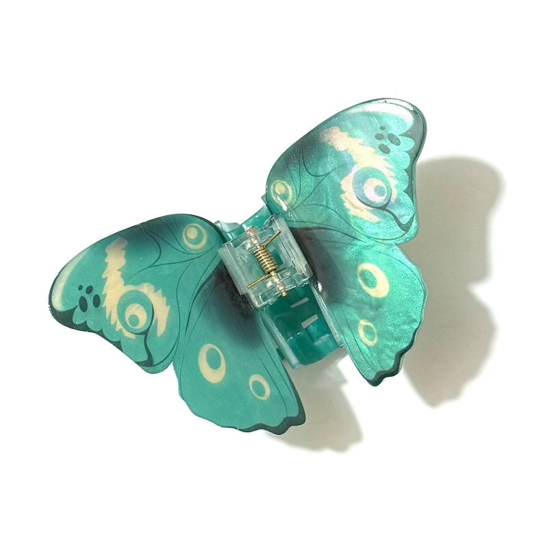 Blue Papilio butterfly design hair claw clamp by Alorar, showcasing intricate wing patterns on a stylish hair accessory.