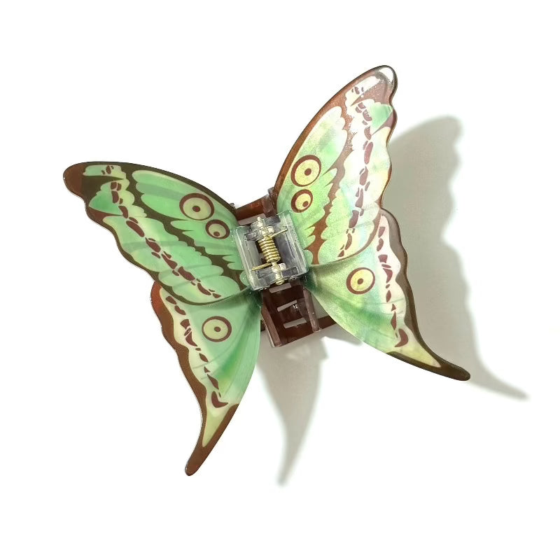 Green Dragontail Butterfly Hair Claw by Alorar with intricate butterfly design and vibrant green color, ideal for styling.