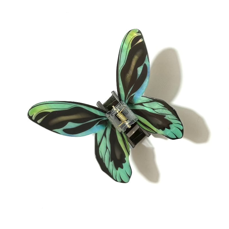 Blue green flash butterfly hair claw clamp by Alorar, featuring intricate butterfly design and sturdy grip for stylish hair styling.