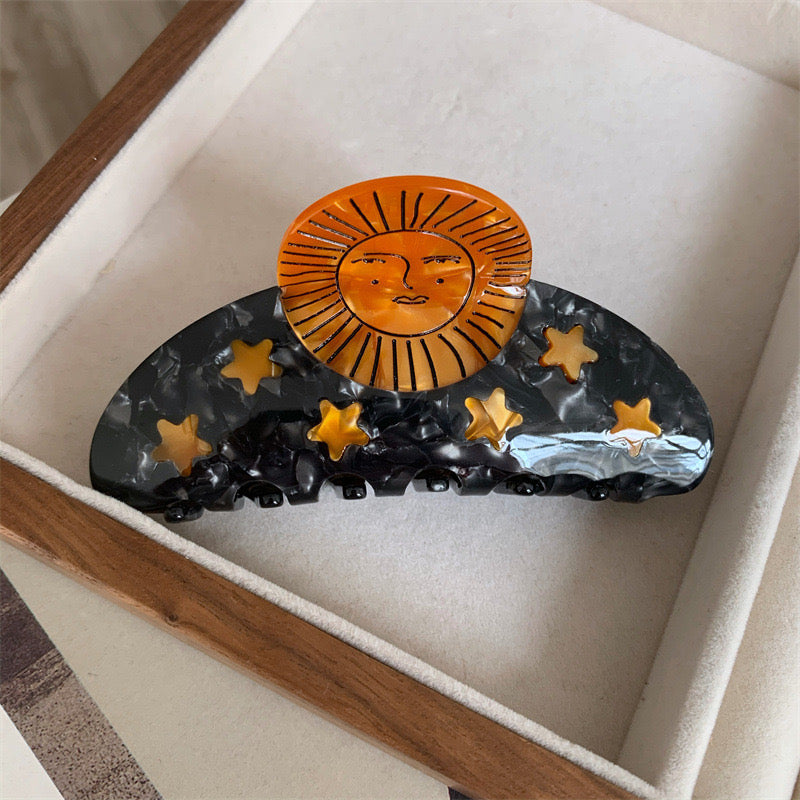 Alorar Sun Sunshine Hair Claw, a vibrant yellow claw clamp with a floral design for secure hair styling.