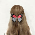 Alorar red ring skirt butterfly hair claw clamp with intricate butterfly design and sturdy grip for stylish hair styling.