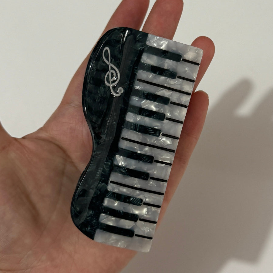 Alorar classic piano hair claw clamp in elegant design, perfect for securing hair with style and ease.