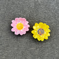 Alorar soft daisy hair claw in pastel colors, featuring a floral design and sturdy grip for secure hair styling.