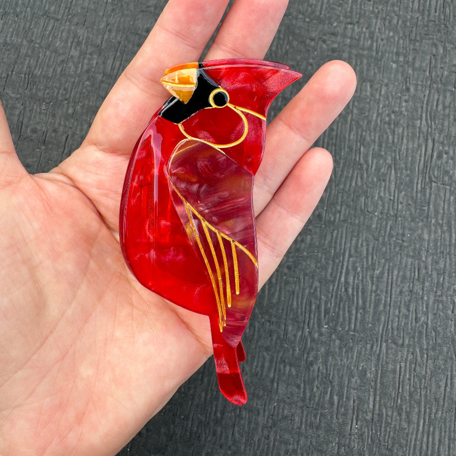 Alorar cardinal bird hair claw clamp featuring a vibrant red and black design, perfect for securing hairstyles.